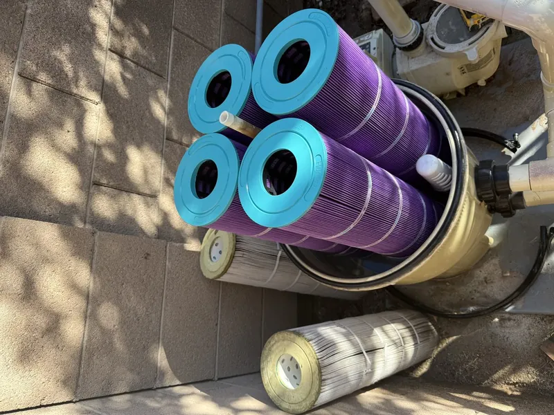 Pool cartridge filters being professionally cleaned
